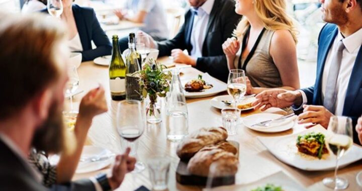 A neatly set dining table with plates, utensils, and napkins, showcasing proper table etiquette