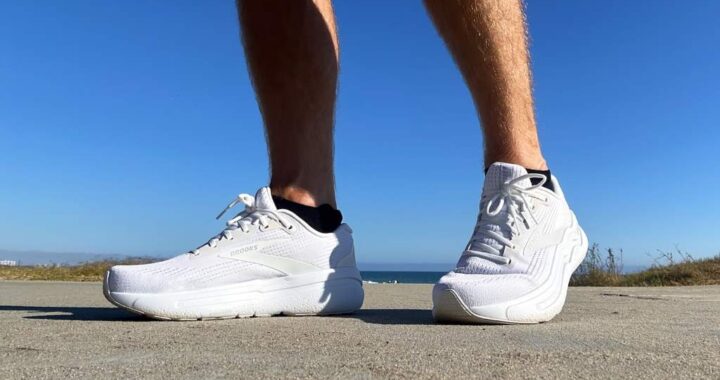 Runner wearing Brooks Ghost Max 2, showcasing plush cushioning on a road.