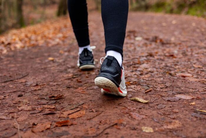 Legs and shoes of sport man runner off road running