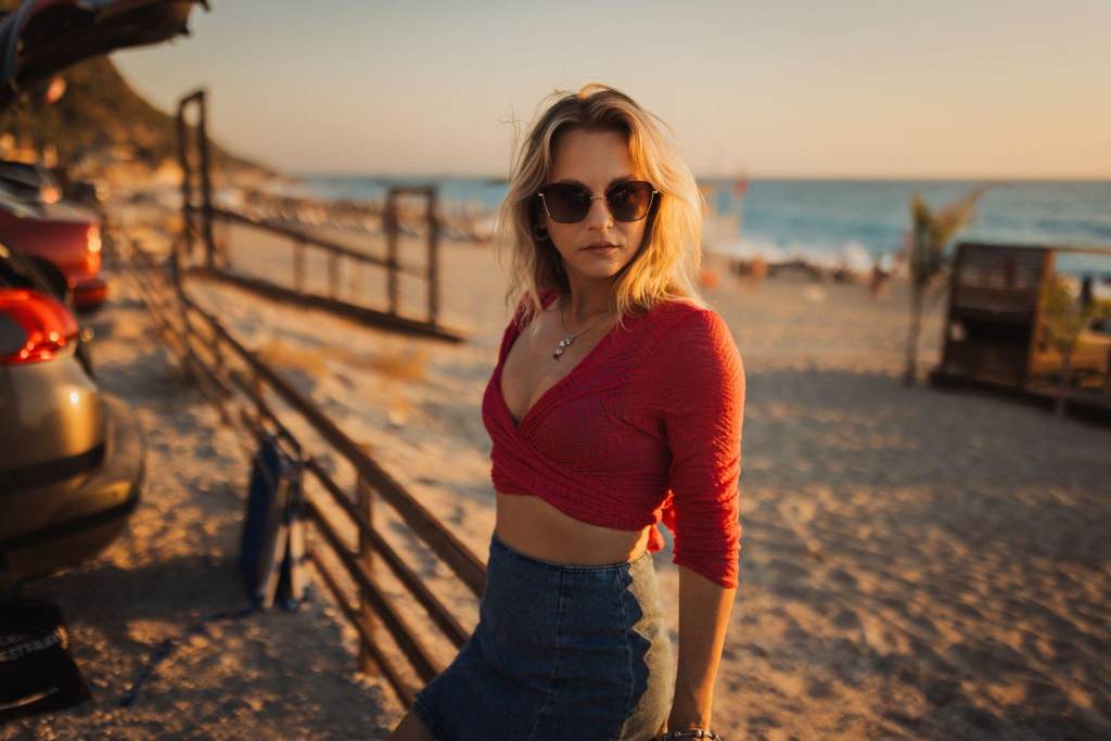 Woman Wearing Sunglasses Relaxing at the Beach on a Summer Day
