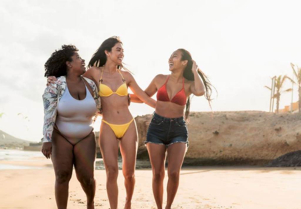 Women wearing stylish and comfortable bikini sets on a sunny beach