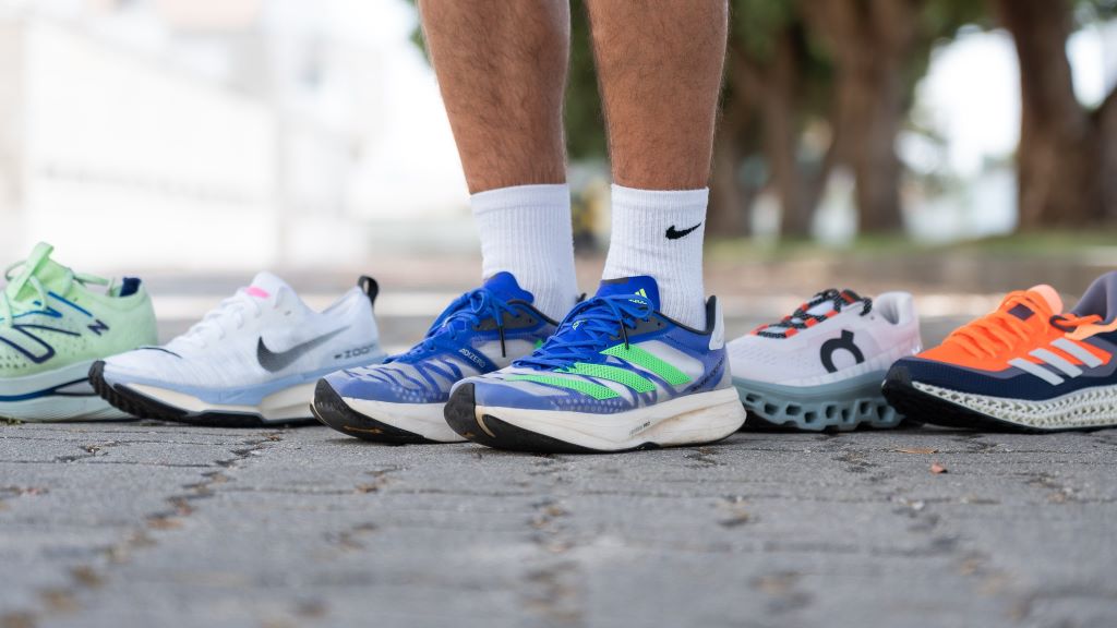 Runner wearing cushioned running shoes on a smooth road for comfort and performance