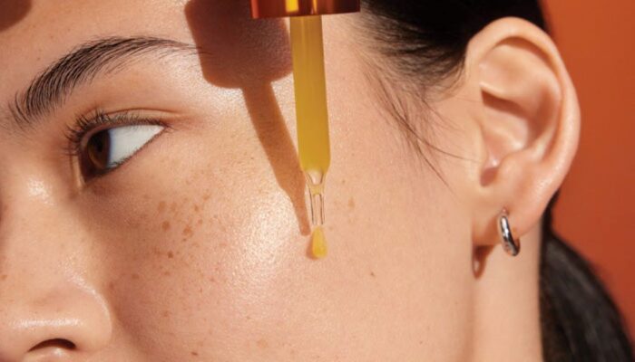 Close-up of hydrated glowing skin after using Vitamin C facial serum
