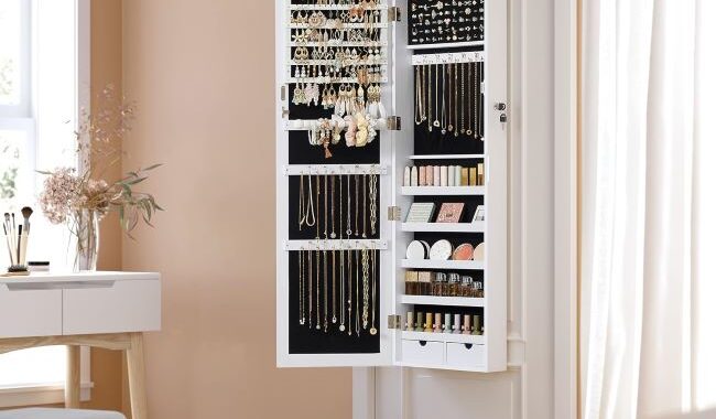 White SONGMICS mirrored jewelry cabinet with interior LED lights for easy jewelry selection in a New York home
