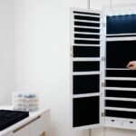 Songmics LED Jewelry Cabinet with organized necklaces and earrings